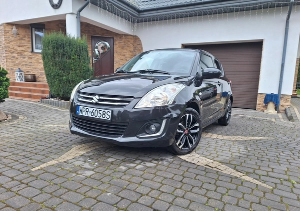Suzuki Swift cena 34700 przebieg: 100200, rok produkcji 2015 z Żychlin małe 326